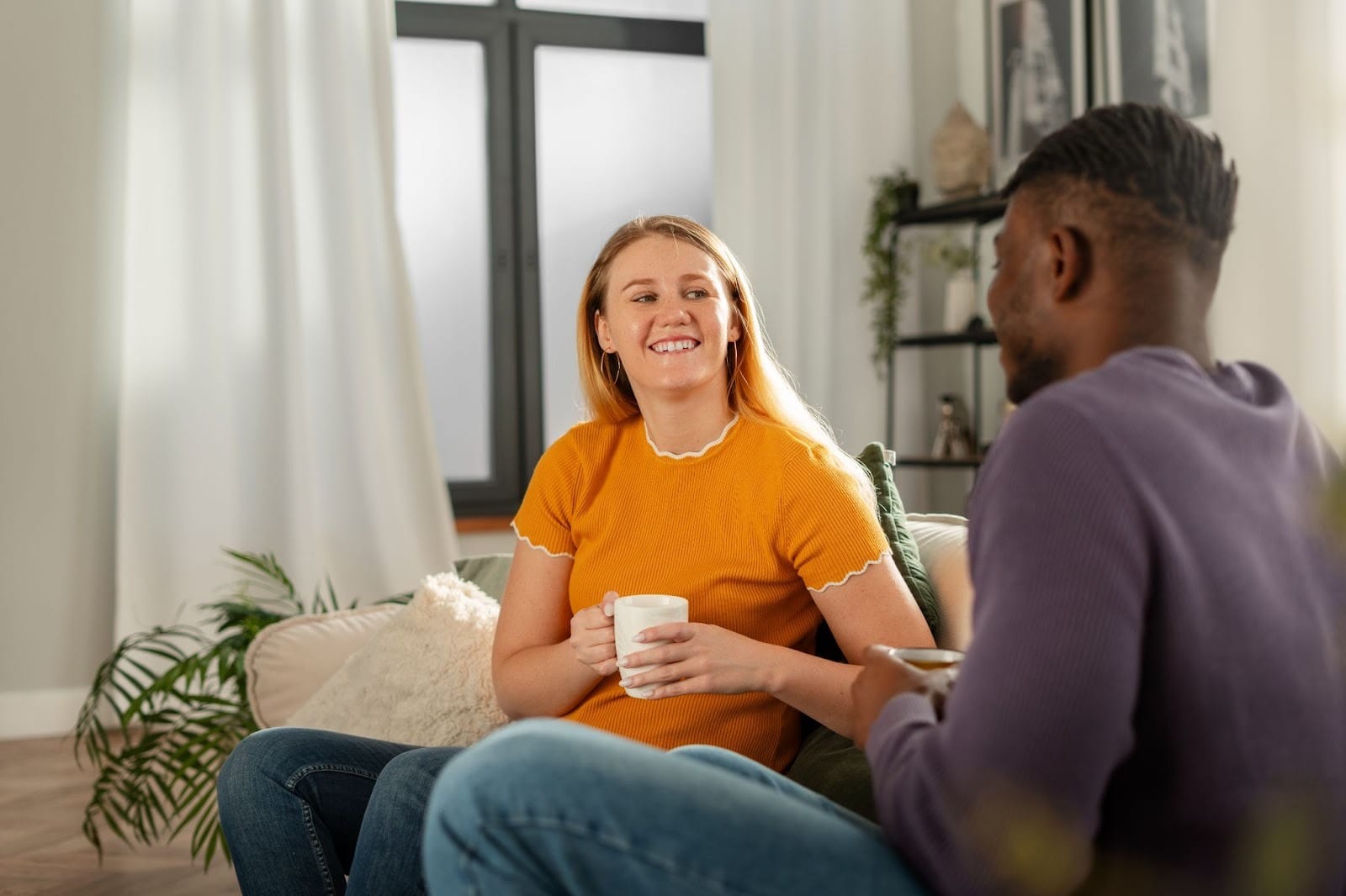 Two people talking in a supportive counseling session, representing therapy and relapse prevention in an intensive outpatient program
